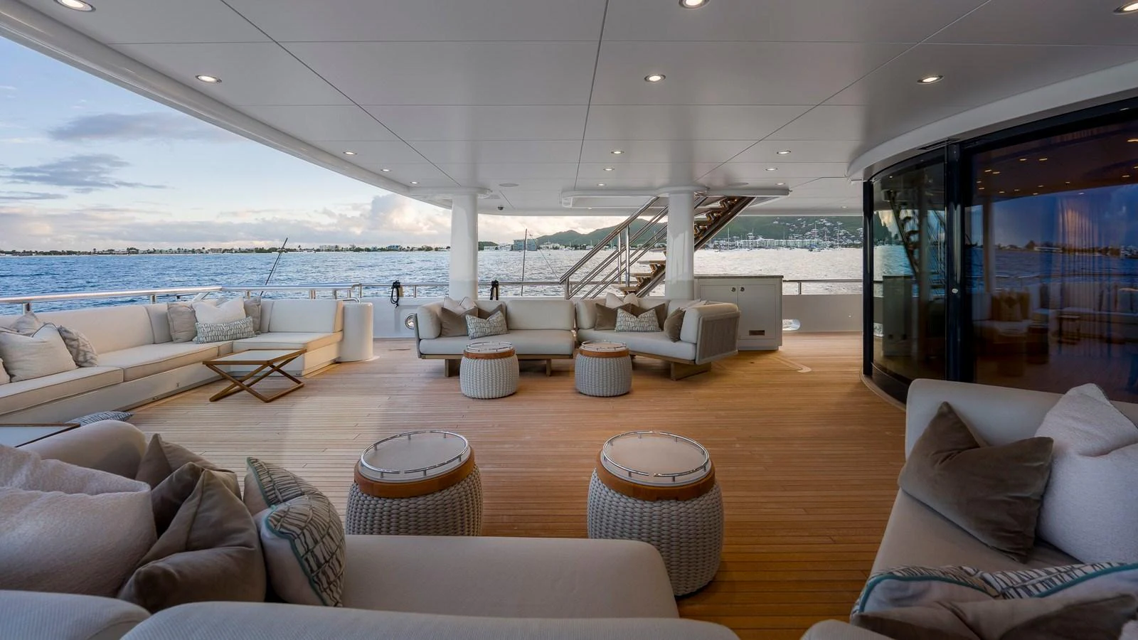 The spacious aft deck offers luxurious seating with stunning ocean views. aboard NENINKA Yacht for Sale