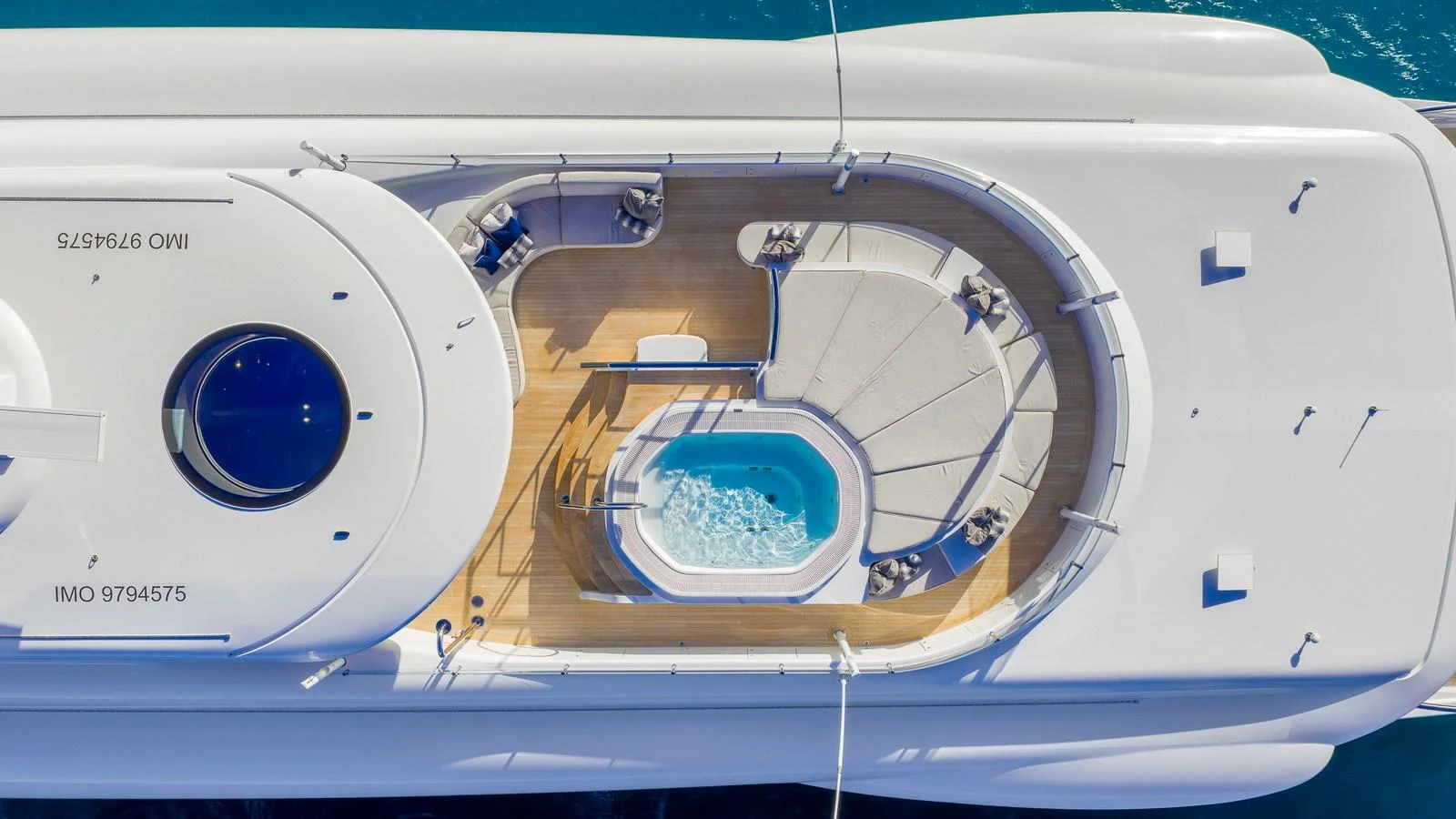 An aerial view of the yacht's sundeck featuring a jacuzzi and lounging area. aboard NENINKA Yacht for Sale