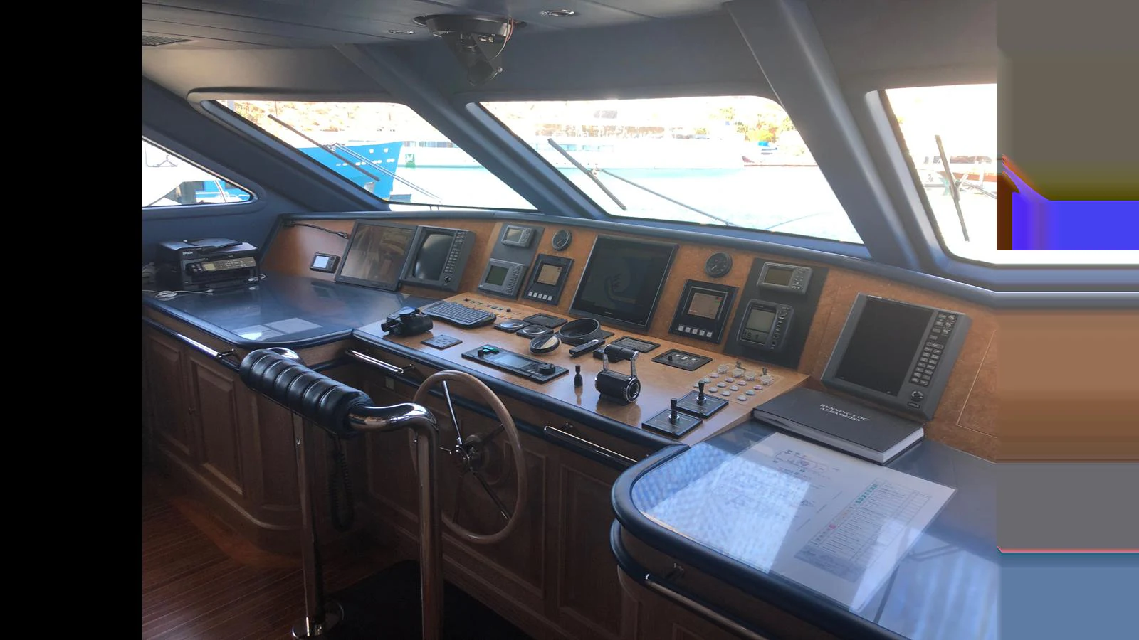 The helm station features advanced navigation equipment and a sleek design. aboard ALBATROSS Yacht for Sale