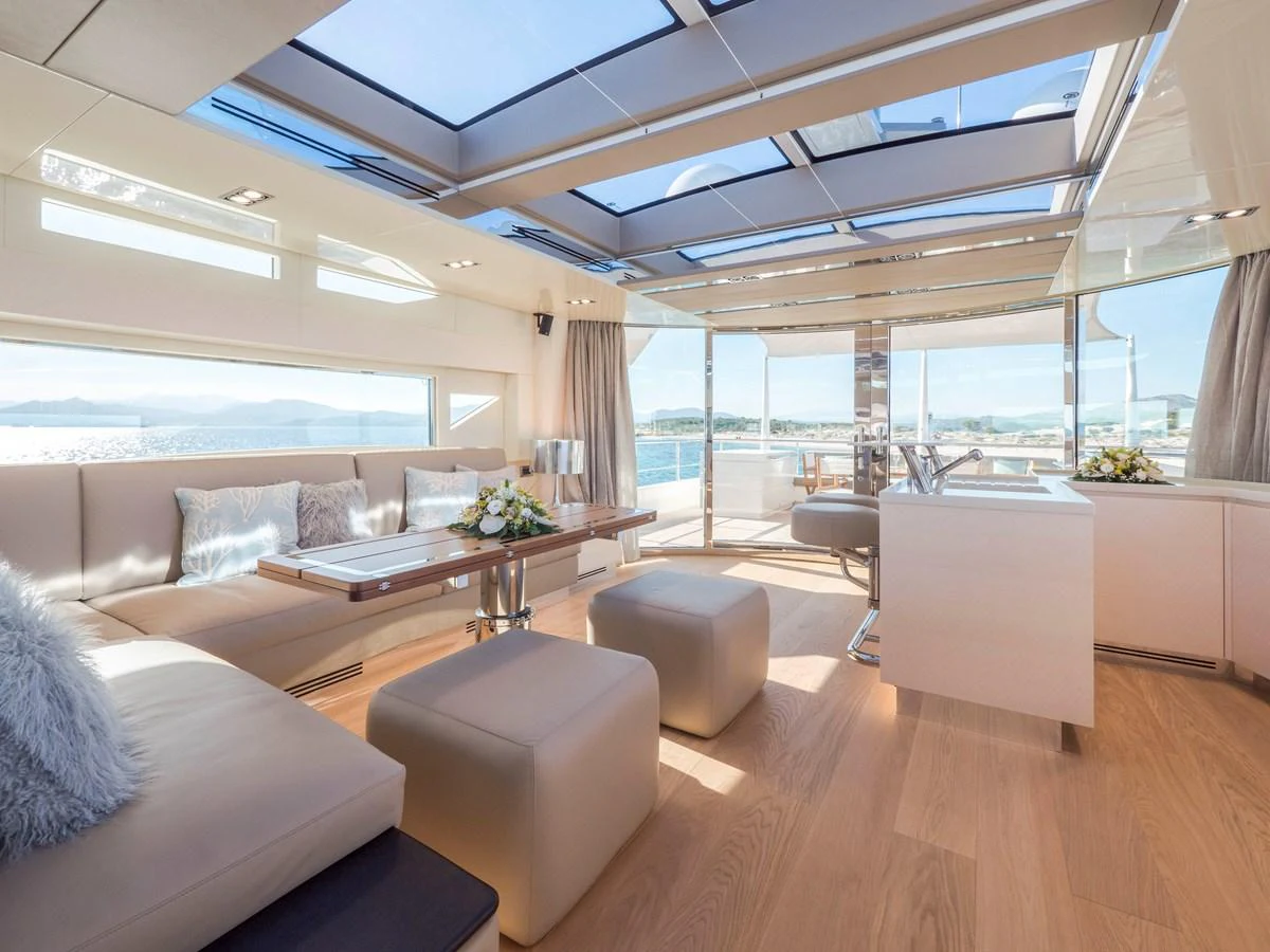 The salon features a spacious and modern design with ample natural light and luxurious furnishings. aboard MAXIMA Yacht for Sale
