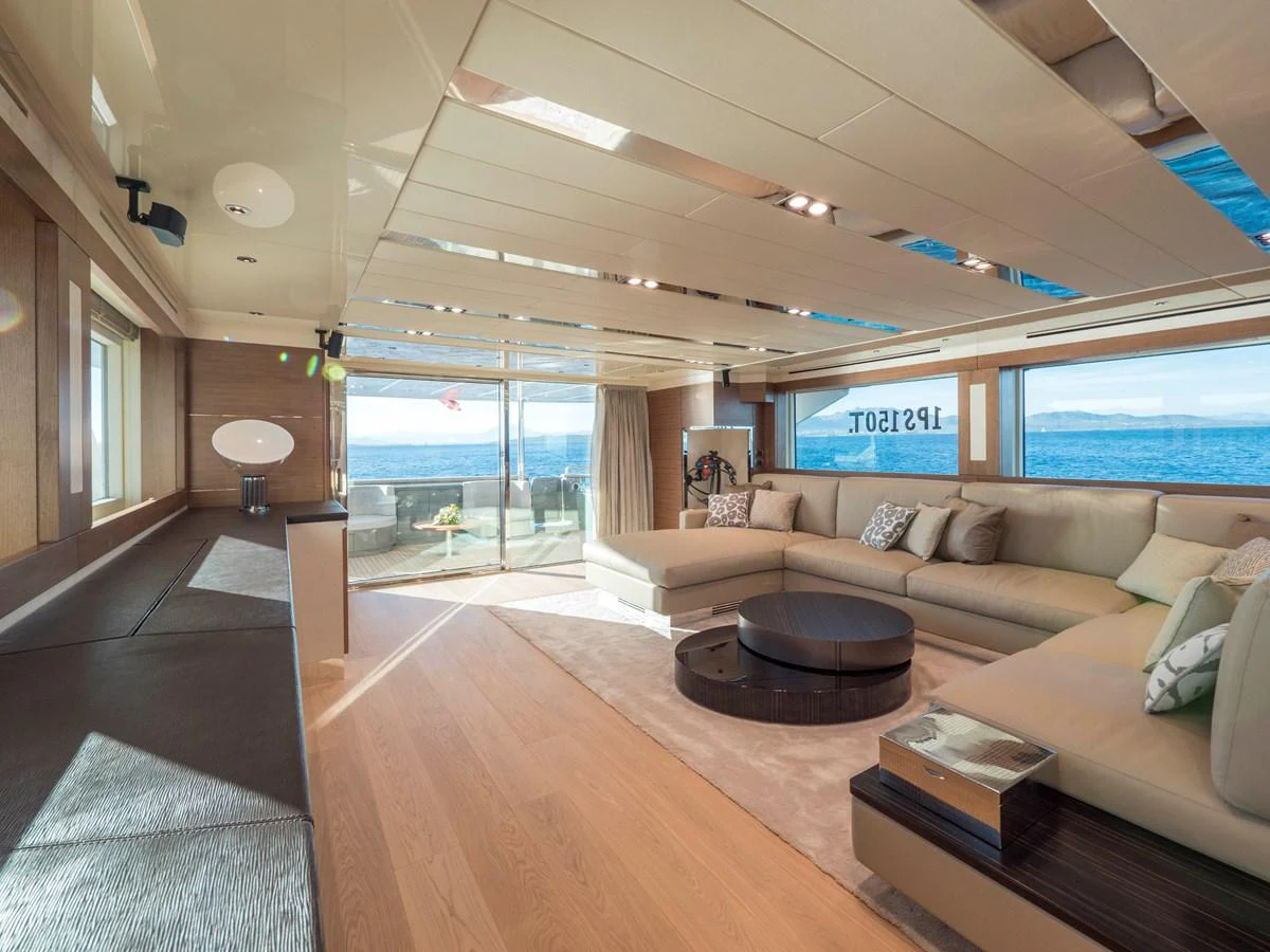 The salon offers a spacious and luxurious seating area with panoramic views. aboard MAXIMA Yacht for Sale