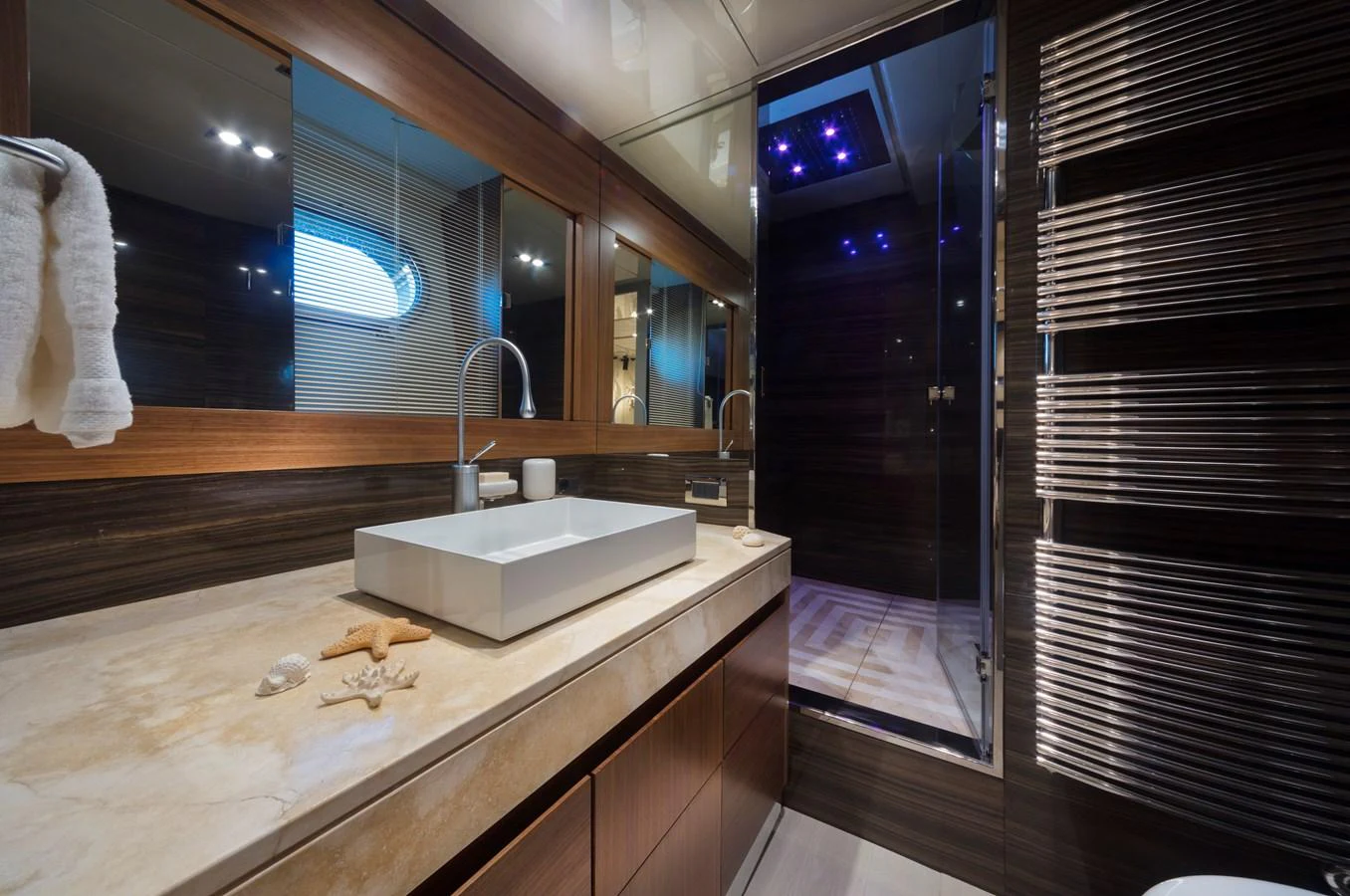 This luxurious yacht bathroom features modern fixtures and elegant design. aboard MAXIMA Yacht for Sale