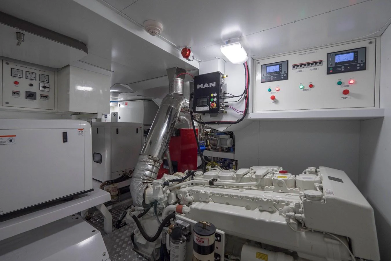The engine room showcases advanced machinery and control panels, ensuring optimal performance and reliability. aboard MAXIMA Yacht for Sale