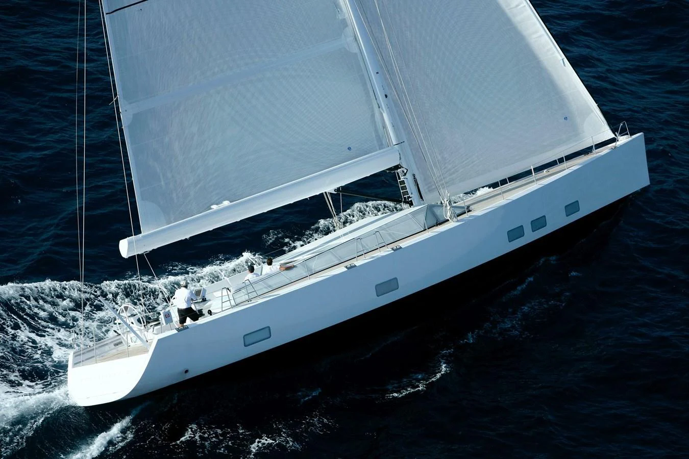 A sleek sailing yacht glides through the water with its sails fully extended. aboard S/Y SENTINEL Yacht for Sale