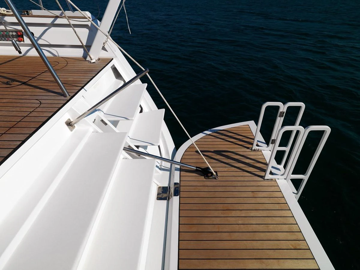 The yacht's swim platform features teak decking and stainless steel handrails, offering easy access to the water. aboard S/Y SENTINEL Yacht for Sale