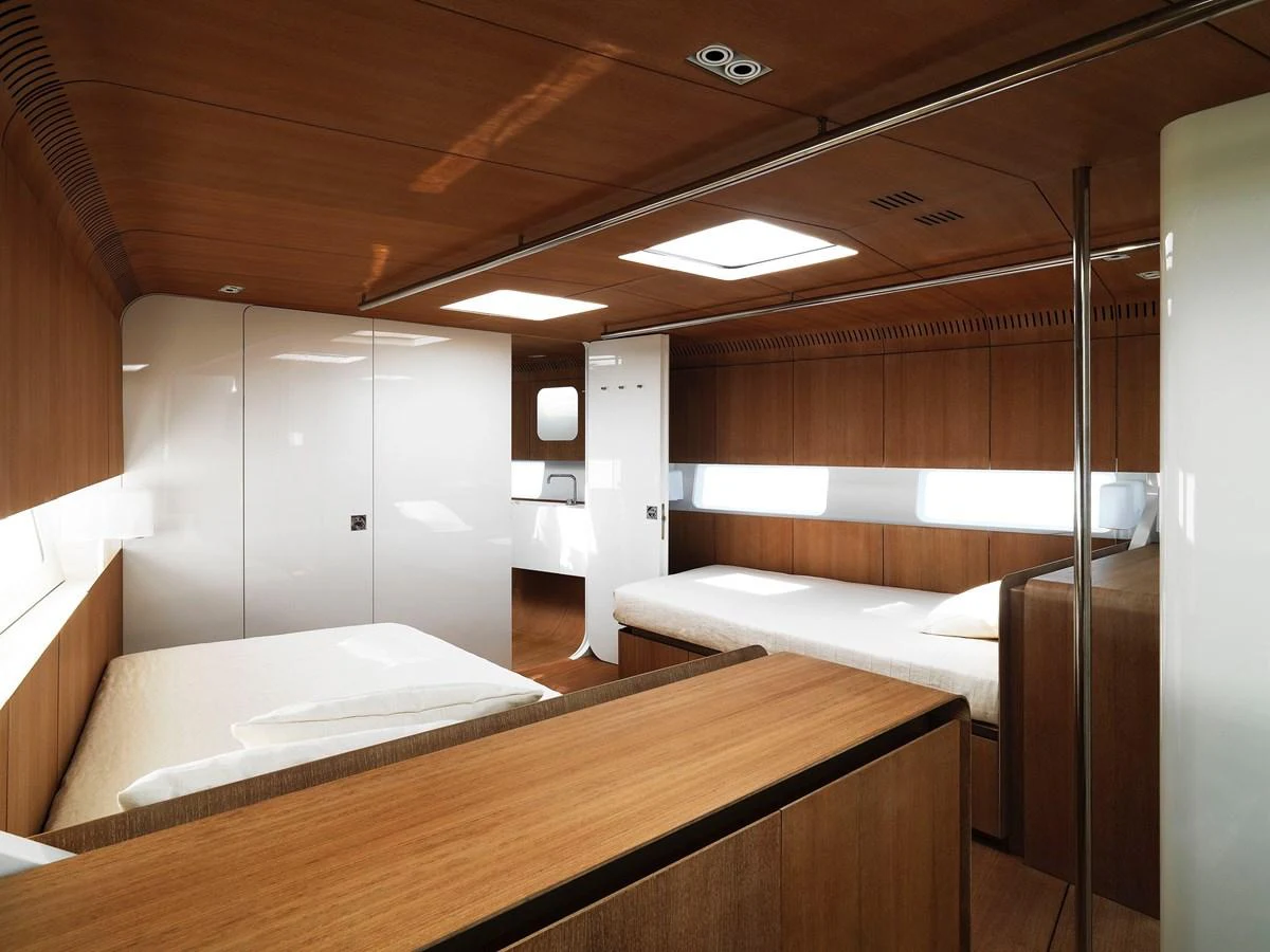 The stateroom features a modern design with wooden accents and ample natural light. aboard S/Y SENTINEL Yacht for Sale
