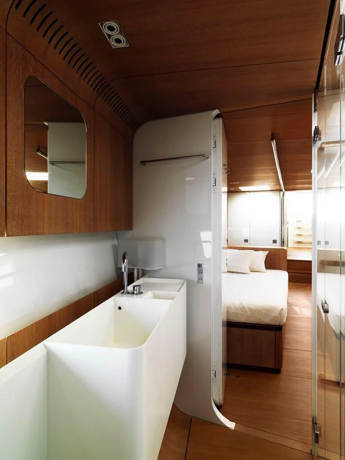 A sleek and modern bathroom with wooden accents and a spacious sink area. aboard S/Y SENTINEL Yacht for Sale
