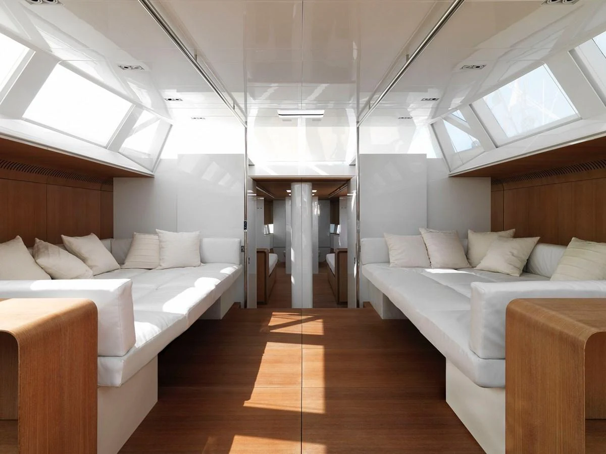 The yacht's interior features a spacious and bright lounging area with comfortable seating and ample natural light. aboard S/Y SENTINEL Yacht for Sale