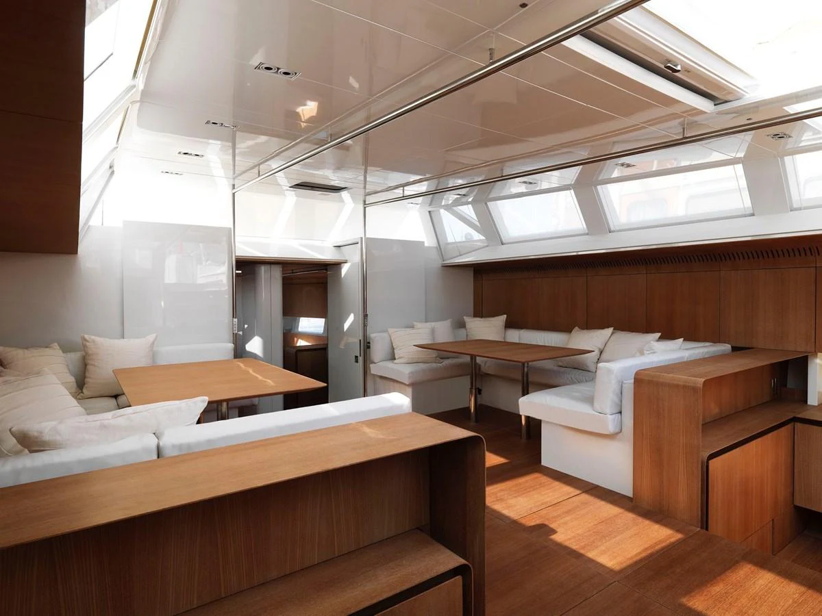 The yacht's saloon features a spacious and modern seating area with ample natural light. aboard S/Y SENTINEL Yacht for Sale