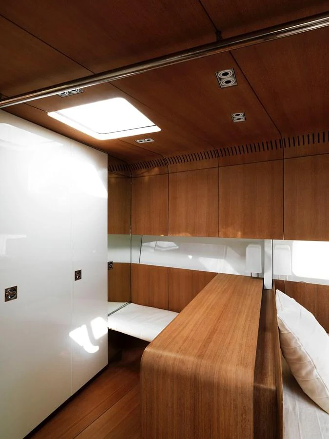The yacht's interior features a sleek, modern design with wooden finishes and ample natural light. aboard S/Y SENTINEL Yacht for Sale