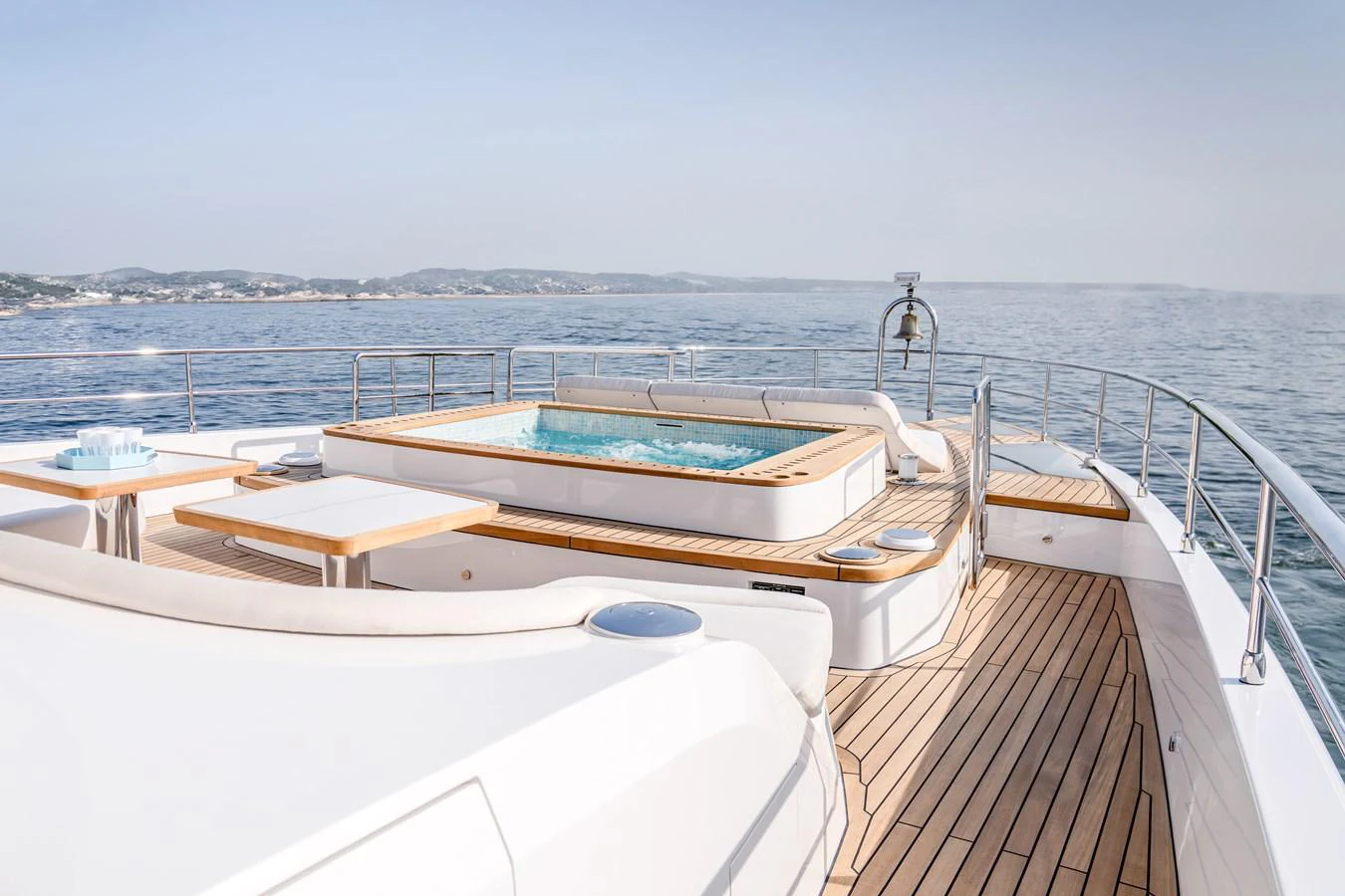 The sundeck features a luxurious jacuzzi surrounded by ample seating and stunning ocean views. aboard MAJESTY 100 TERRACE Yacht for Sale