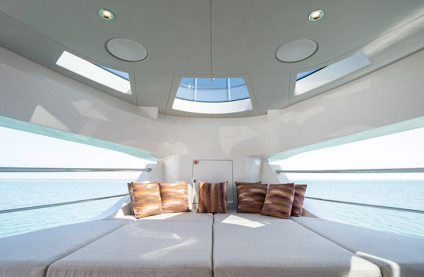A luxurious lounge area with plush seating and panoramic windows offering stunning sea views. aboard MAJESTY 100 TERRACE Yacht for Sale