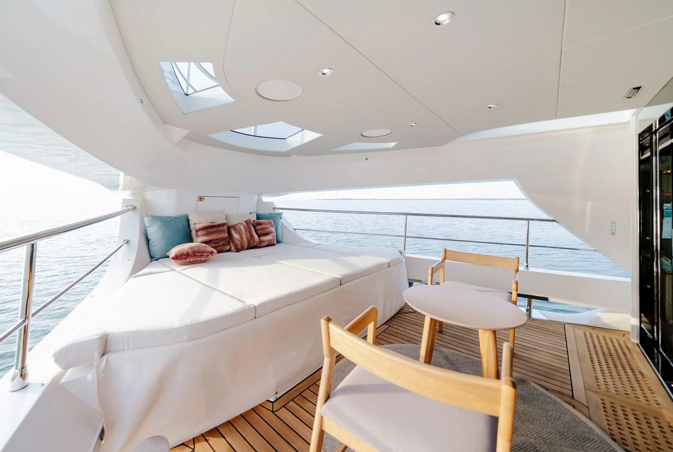 The sundeck offers a luxurious lounging area with comfortable seating and a stunning view of the sea. aboard MAJESTY 100 TERRACE Yacht for Sale