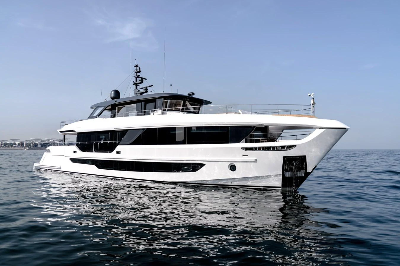 A sleek and modern yacht glides gracefully on calm waters under a clear sky. aboard MAJESTY 100 TERRACE Yacht for Sale