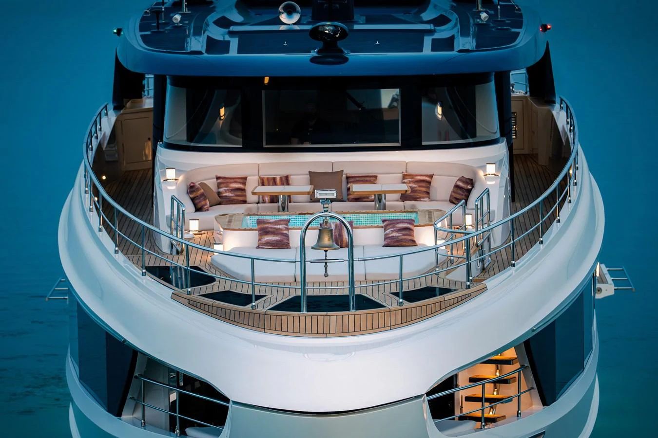 The bow of the yacht features an inviting seating area with plush cushions and elegant lighting. aboard MAJESTY 100 TERRACE Yacht for Sale
