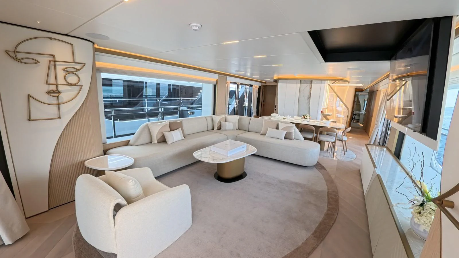 The salon features a modern and elegant design with plush seating and artistic decor. aboard MAJESTY 100 TERRACE Yacht for Sale