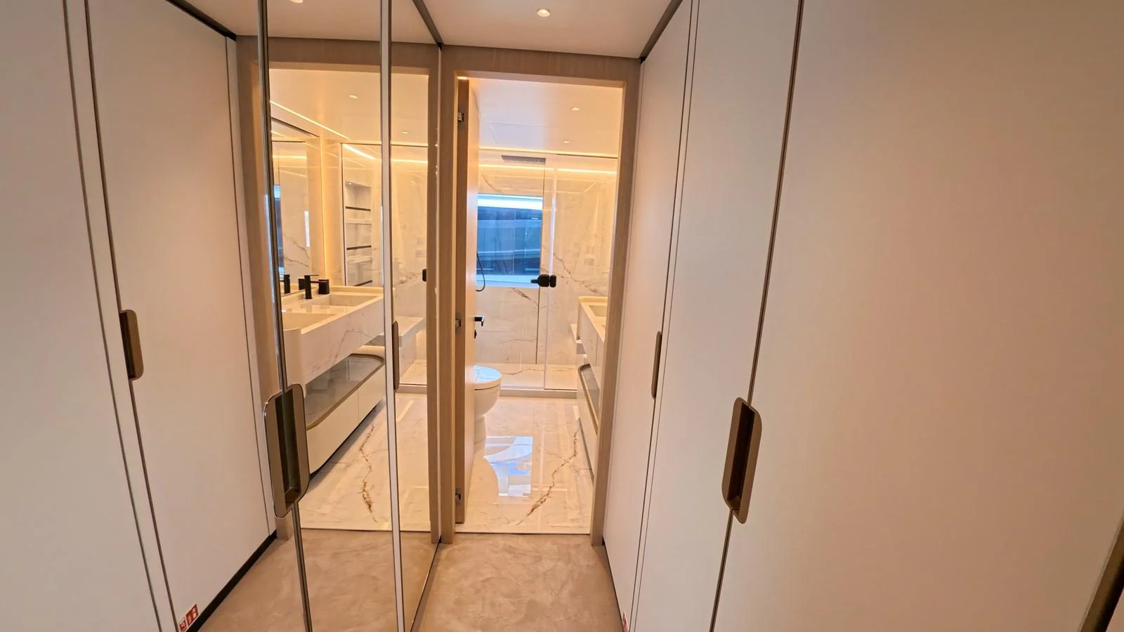 A luxurious yacht bathroom with sleek, modern design and ample lighting. aboard MAJESTY 100 TERRACE Yacht for Sale
