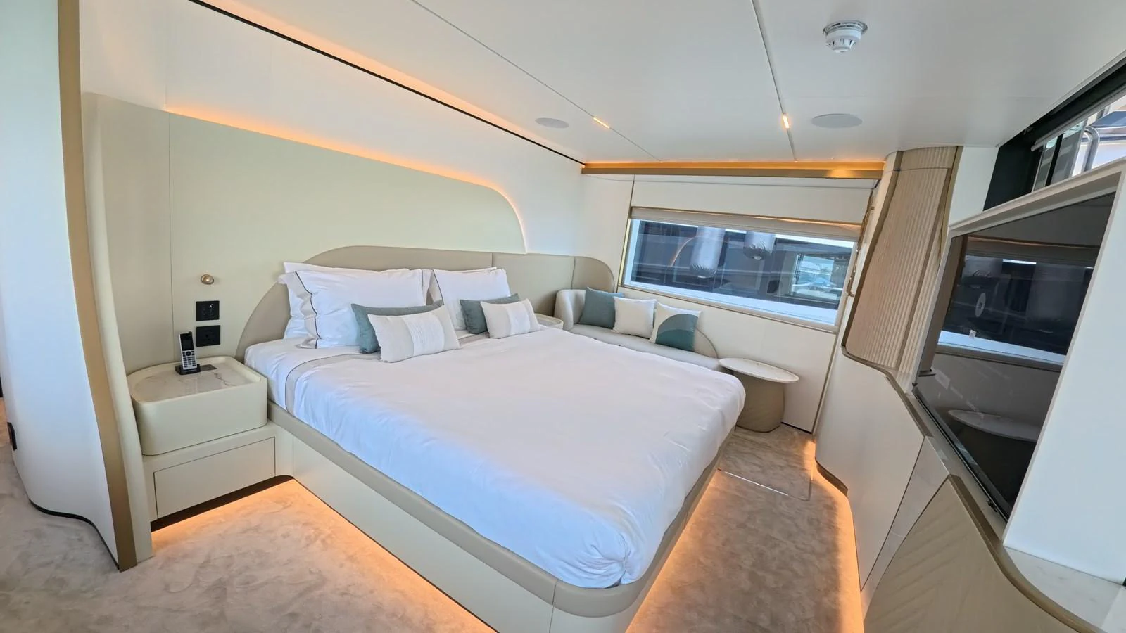 The stateroom features a luxurious bed with elegant lighting and modern furnishings. aboard MAJESTY 100 TERRACE Yacht for Sale