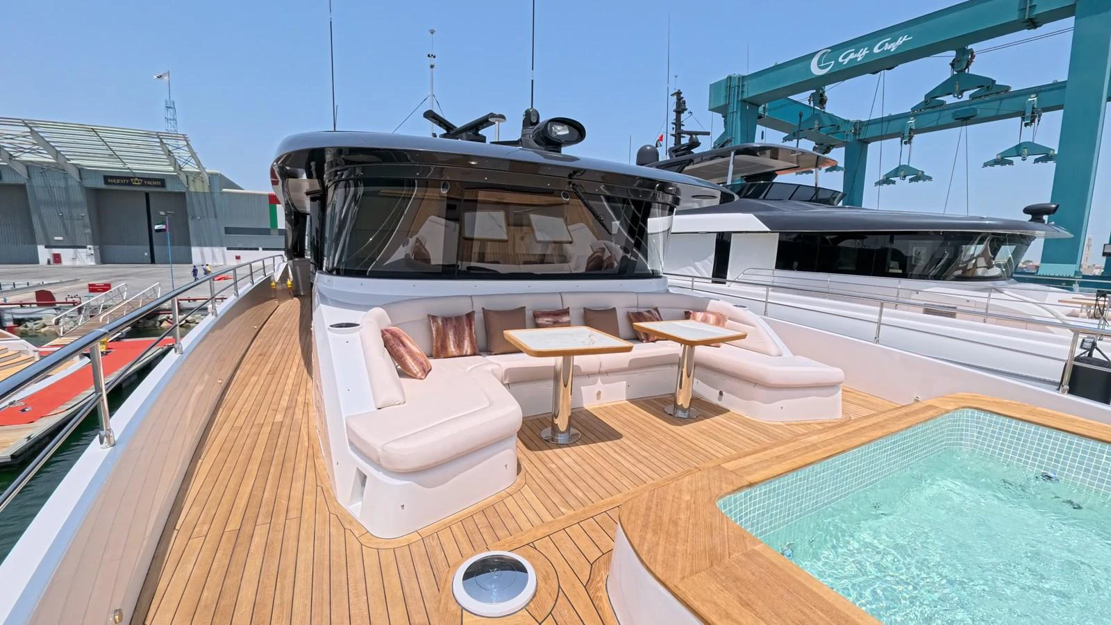 The foredeck features a luxurious seating area with tables and a jacuzzi, perfect for relaxation and socializing. aboard MAJESTY 100 TERRACE Yacht for Sale