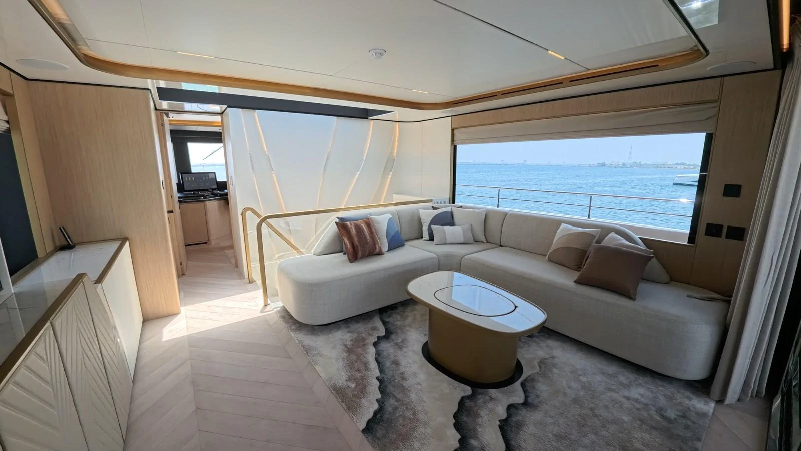 The salon features a modern and elegant design with a comfortable seating area and large windows offering stunning sea views. aboard MAJESTY 100 TERRACE Yacht for Sale