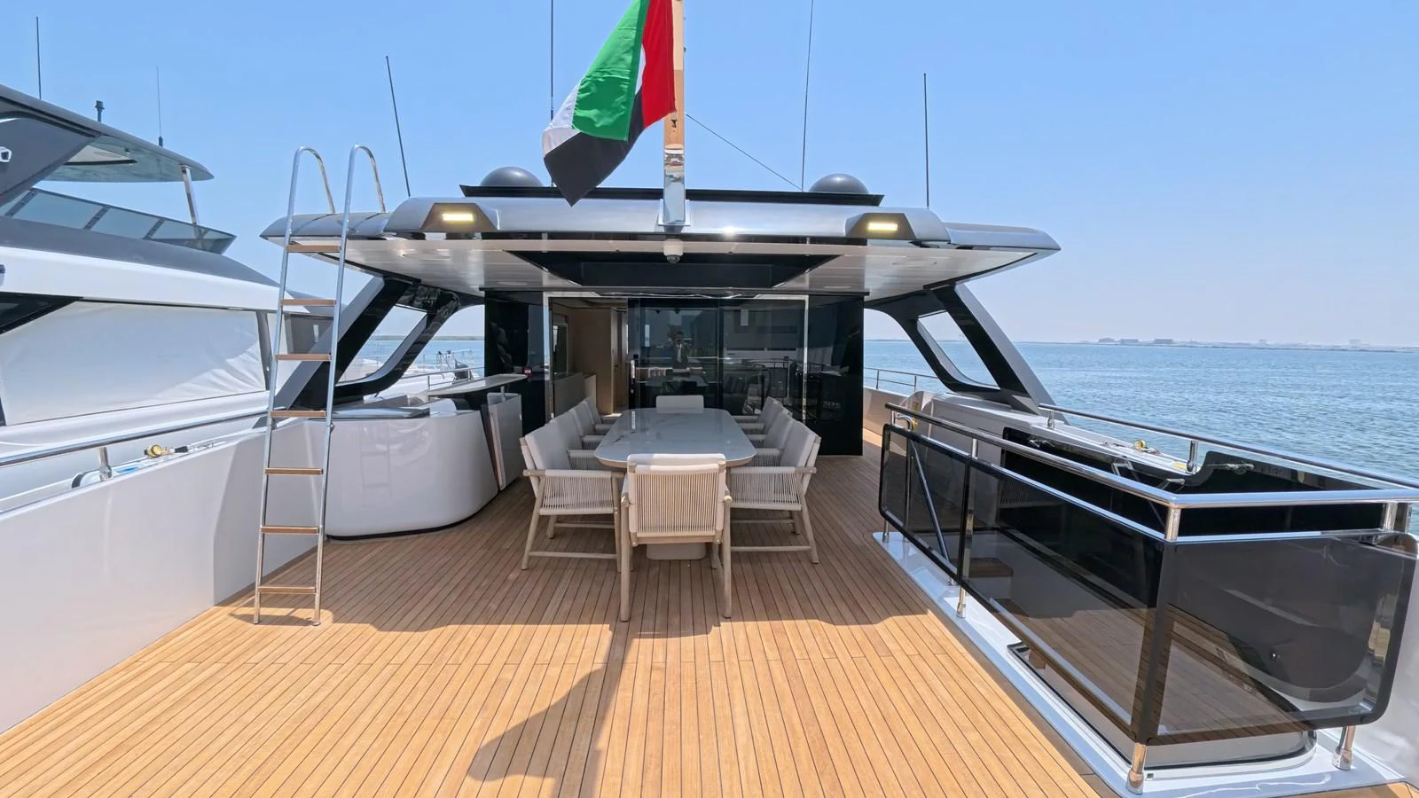 The aft deck offers a spacious and inviting area for alfresco dining and relaxation. aboard MAJESTY 100 TERRACE Yacht for Sale