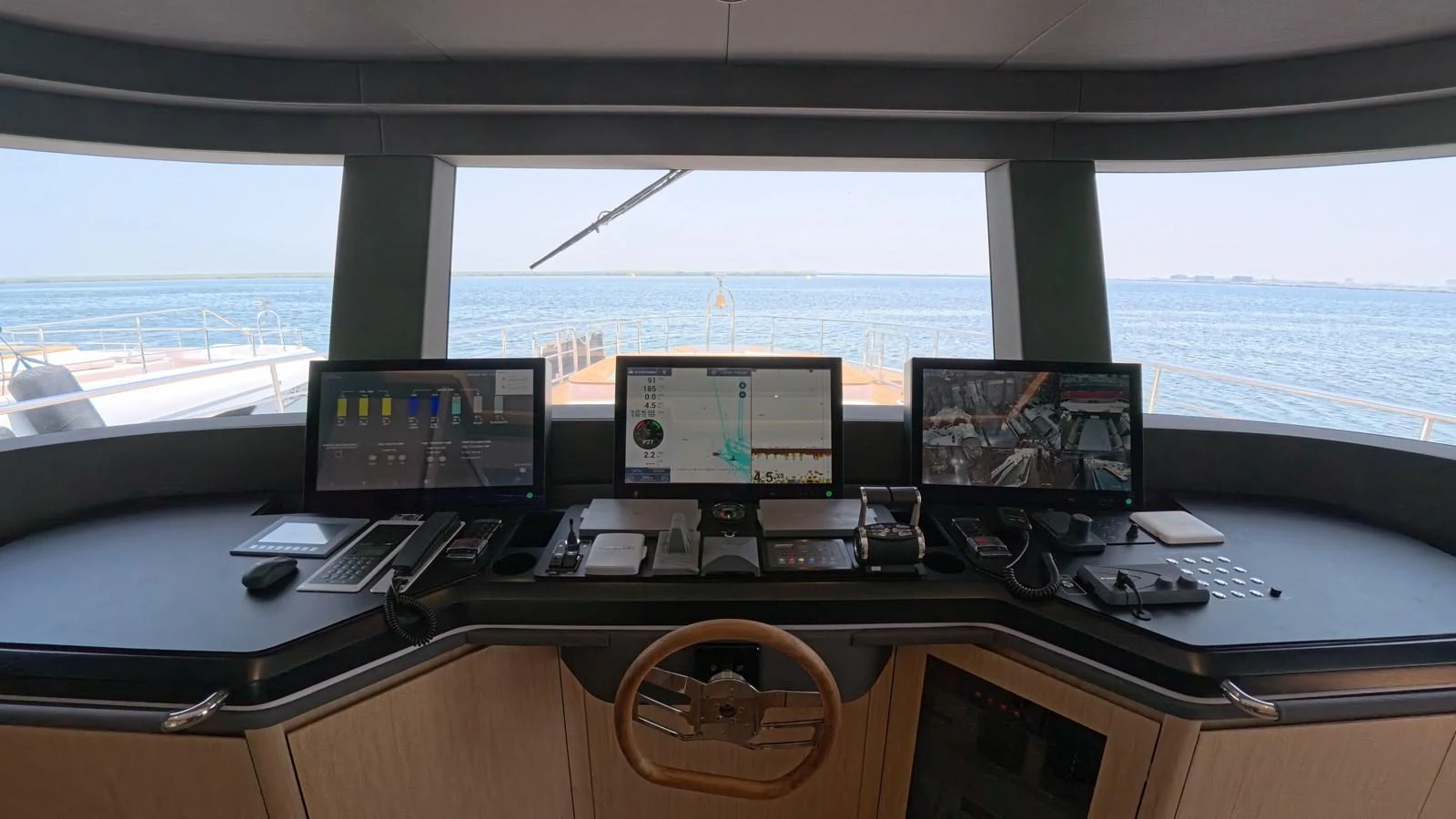 The helm station offers a panoramic view with advanced navigation equipment and a sleek design. aboard MAJESTY 100 TERRACE Yacht for Sale