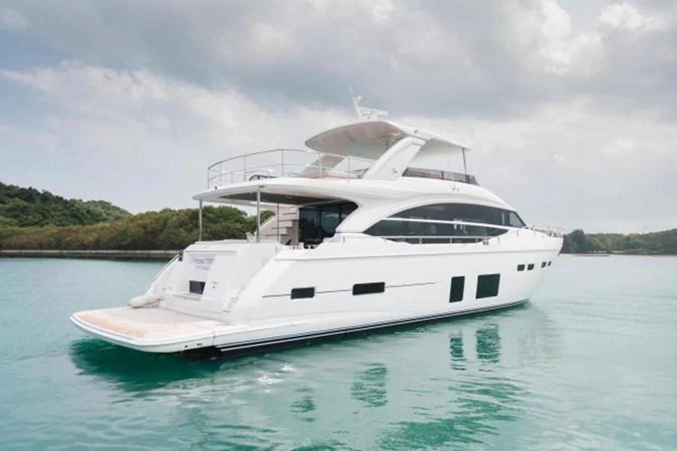 A sleek and modern yacht floats gracefully on calm waters, showcasing its elegant design. aboard PRINCESS CHLOE Yacht for Sale