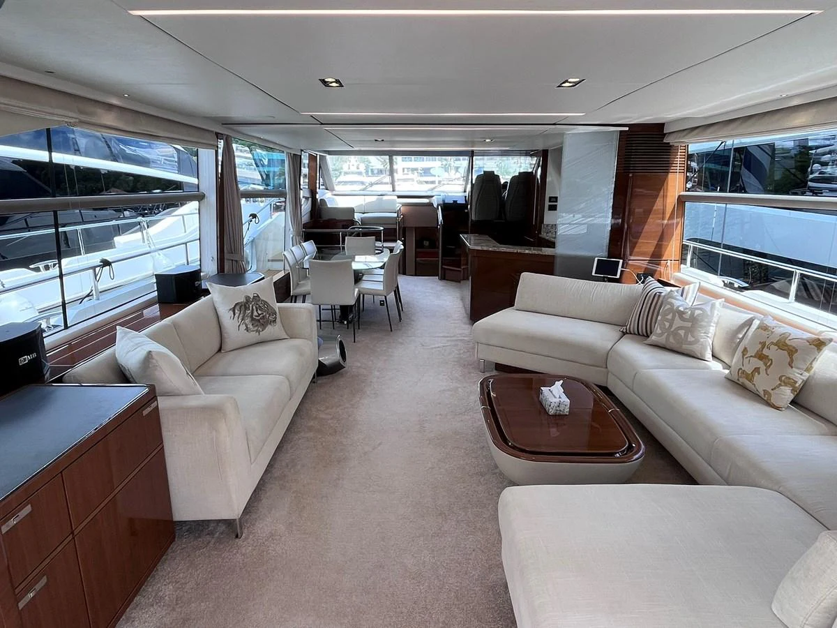 The salon offers a spacious and elegant seating area with ample natural light. aboard PRINCESS CHLOE Yacht for Sale