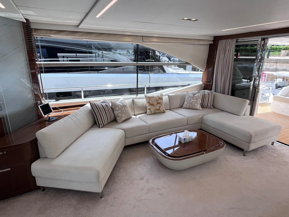 The salon features a spacious and elegant seating area with large windows providing ample natural light. aboard PRINCESS CHLOE Yacht for Sale