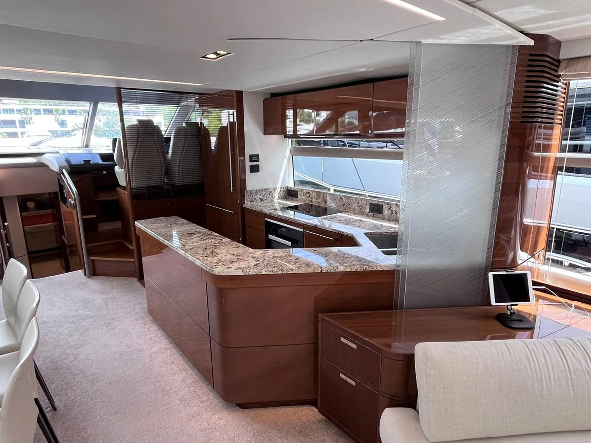 The yacht's galley features modern appliances and elegant wood finishes, creating a luxurious and functional space. aboard PRINCESS CHLOE Yacht for Sale