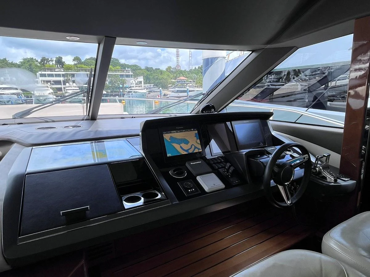 The helm station features advanced navigation equipment and a sleek, modern design. aboard PRINCESS CHLOE Yacht for Sale