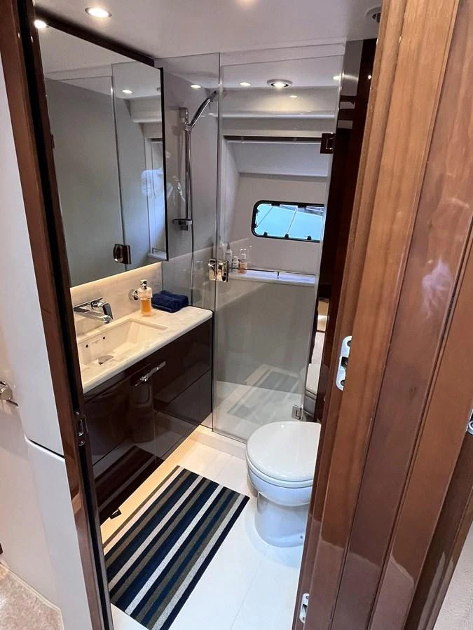 A well-appointed yacht bathroom with modern fixtures and a sleek design. aboard PRINCESS CHLOE Yacht for Sale