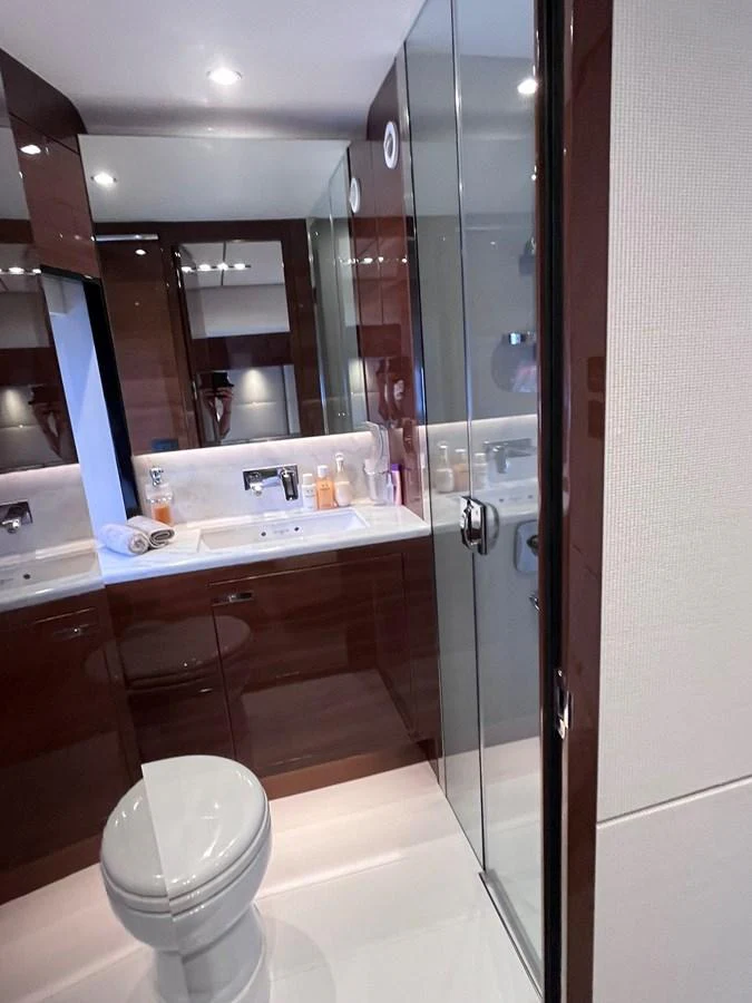 The yacht's bathroom features sleek fixtures and a modern design with a glass-enclosed shower. aboard PRINCESS CHLOE Yacht for Sale
