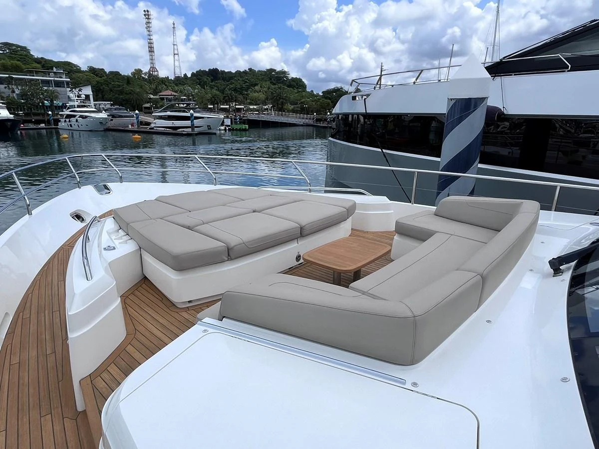 The foredeck features spacious sun pads and comfortable seating, perfect for relaxation. aboard PRINCESS CHLOE Yacht for Sale