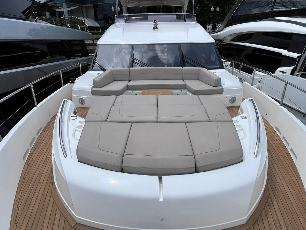 The yacht's foredeck features a spacious sunpad with plush cushions for ultimate relaxation. aboard PRINCESS CHLOE Yacht for Sale