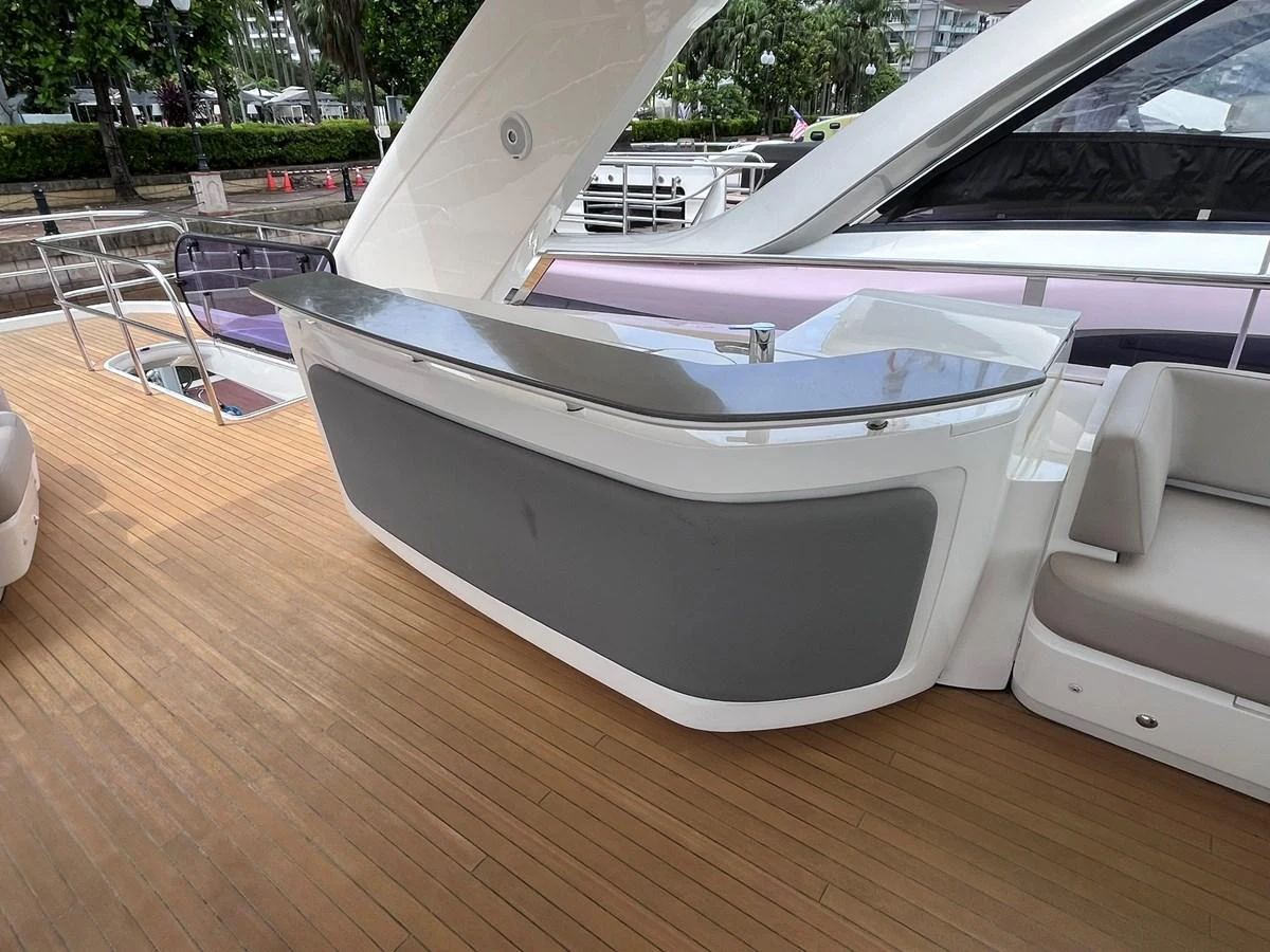 The yacht features a sleek outdoor bar area with a modern design and comfortable seating. aboard PRINCESS CHLOE Yacht for Sale