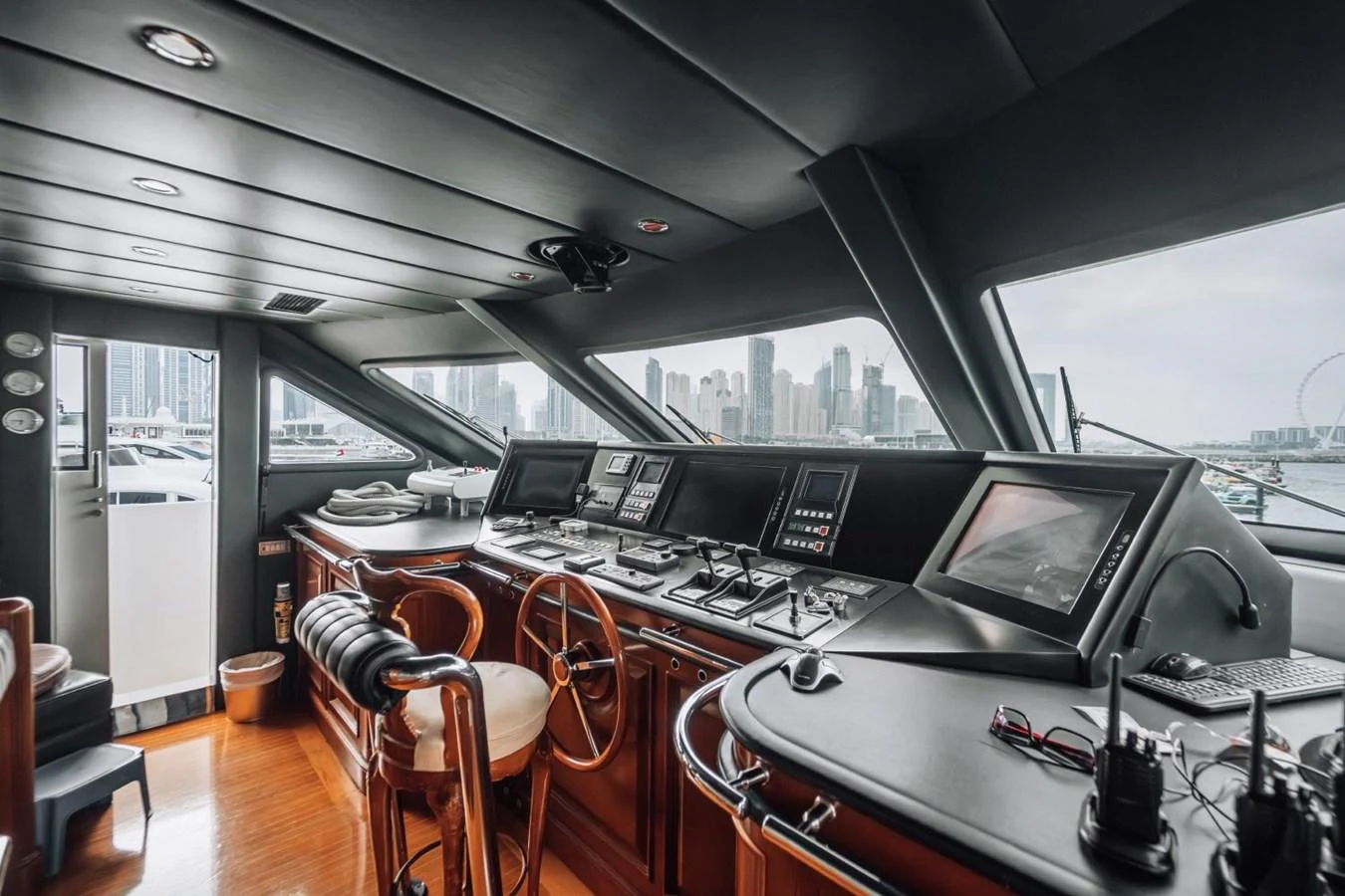 The helm station offers a commanding view with state-of-the-art navigation equipment and luxurious seating. aboard GALLUS Yacht for Sale