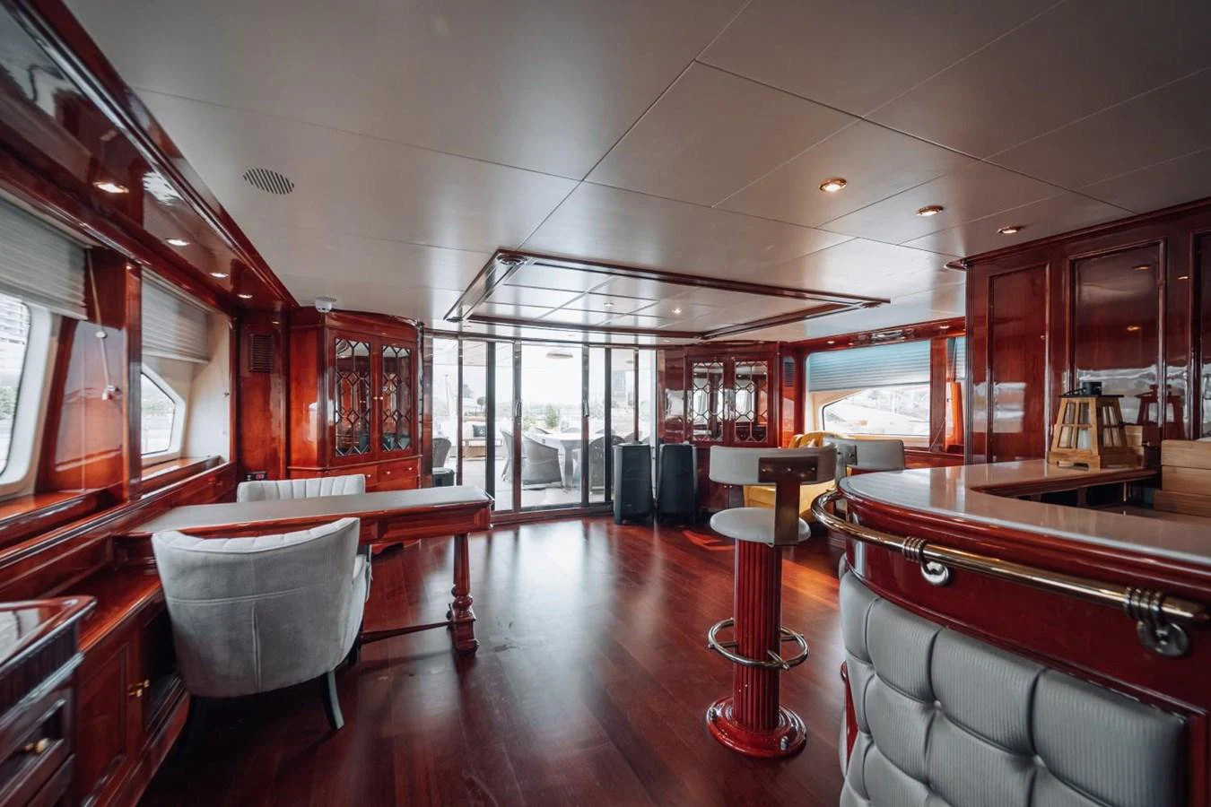 The yacht's interior features luxurious wood finishes and ample seating areas, creating a warm and inviting atmosphere. aboard GALLUS Yacht for Sale