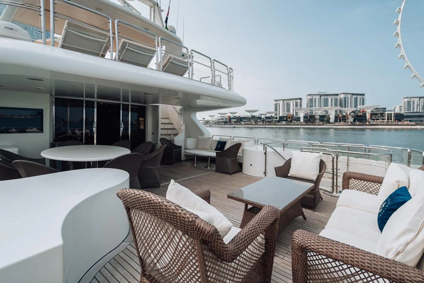 The aft deck offers a spacious and comfortable outdoor seating area with a stunning waterfront view. aboard GALLUS Yacht for Sale