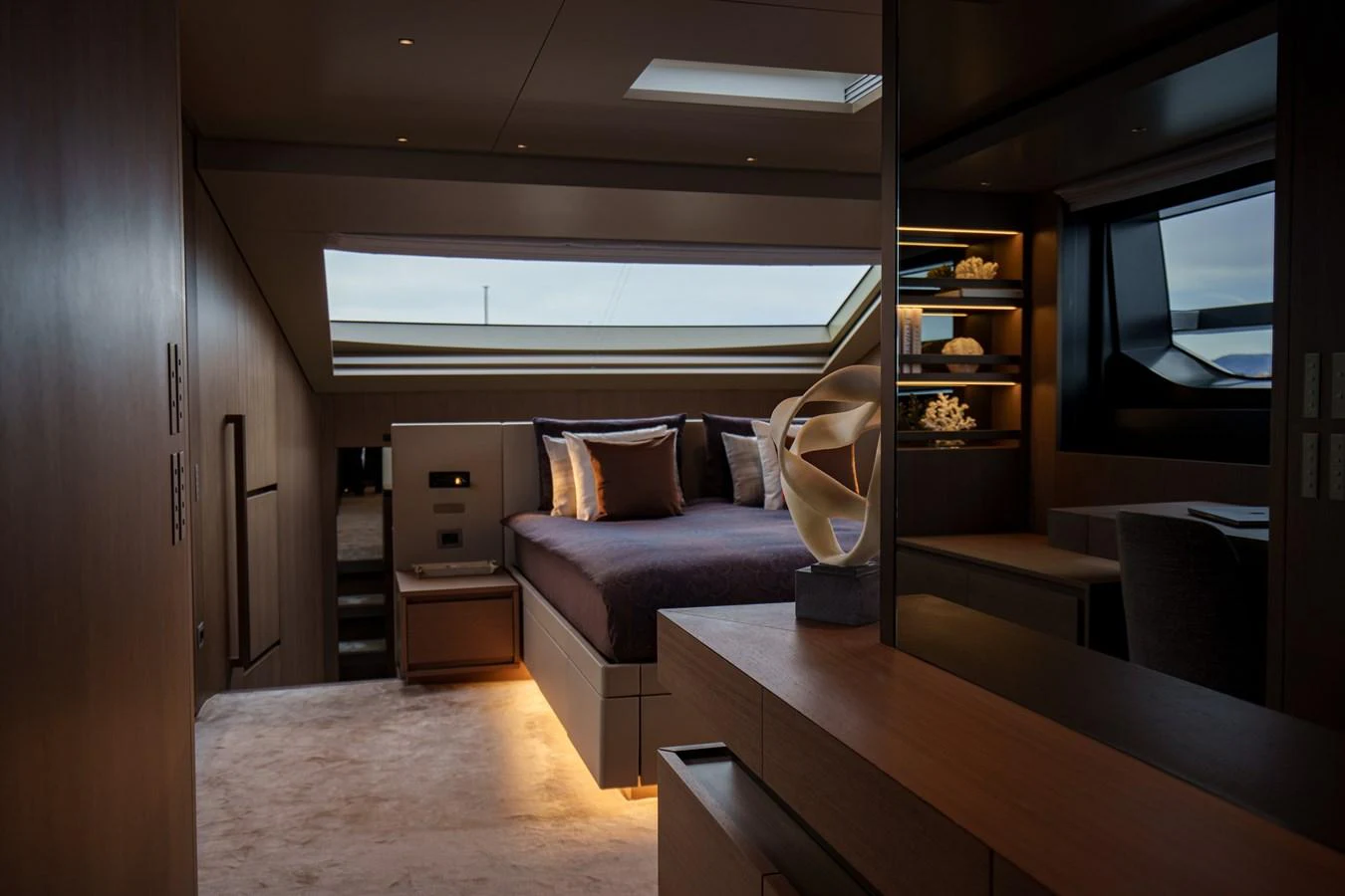 The master stateroom exudes luxury with its modern design and ambient lighting. aboard DESTINO Yacht for Sale