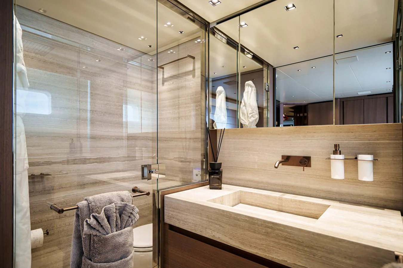The yacht's bathroom features a sleek, modern design with luxurious finishes and ample lighting. aboard DESTINO Yacht for Sale