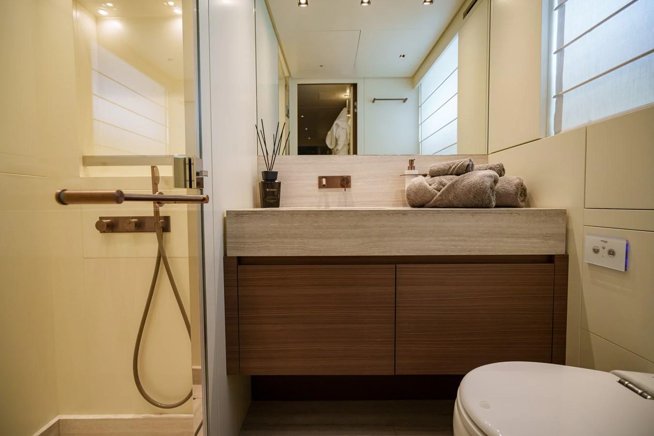 The yacht's bathroom features modern fixtures and a sleek design. aboard DESTINO Yacht for Sale