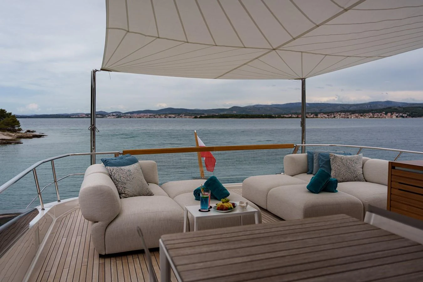 The aft deck offers a luxurious lounging area with plush seating and a stunning view of the water. aboard DESTINO Yacht for Sale