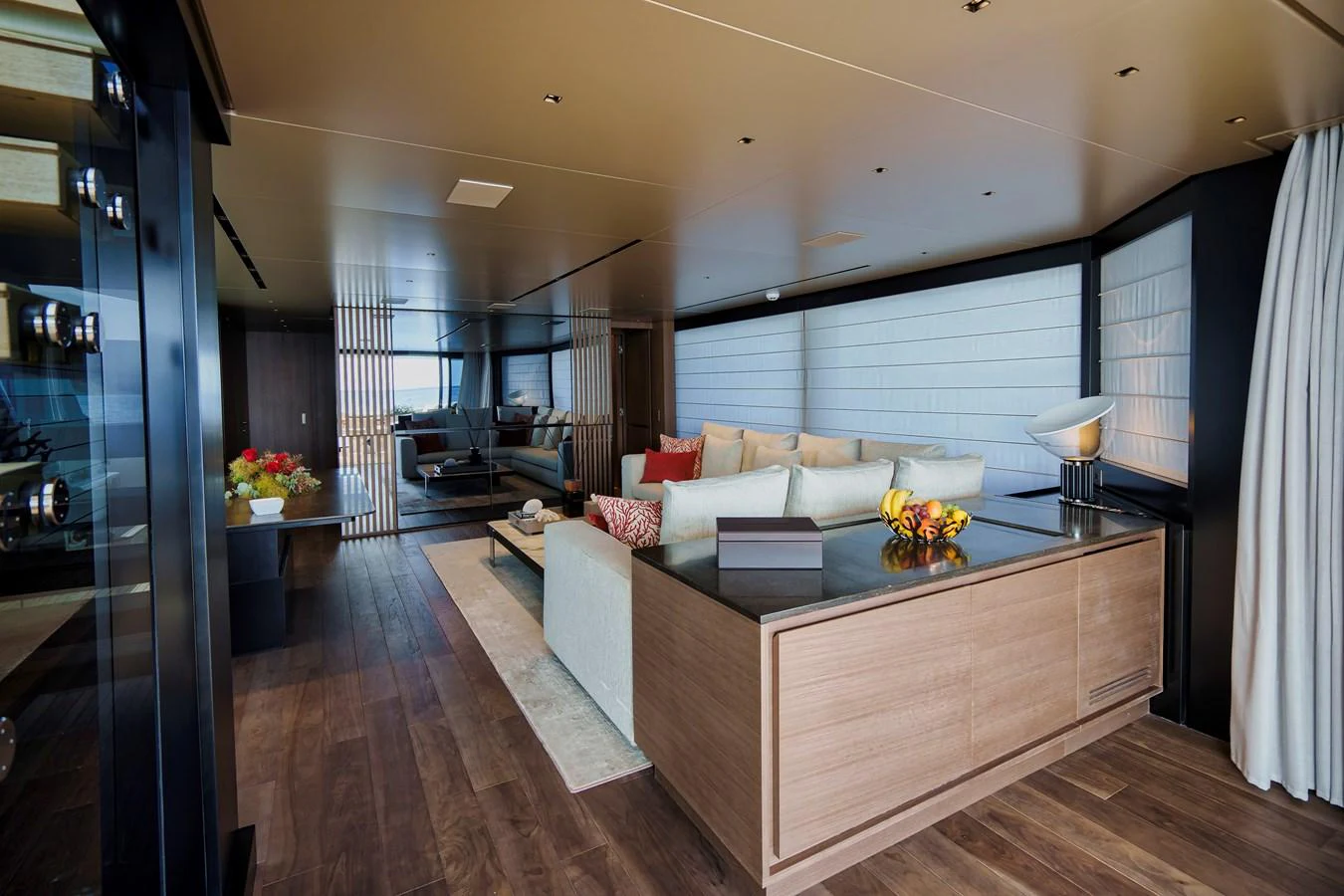 The yacht's salon features a spacious and elegantly designed seating area with modern furnishings and warm lighting. aboard DESTINO Yacht for Sale