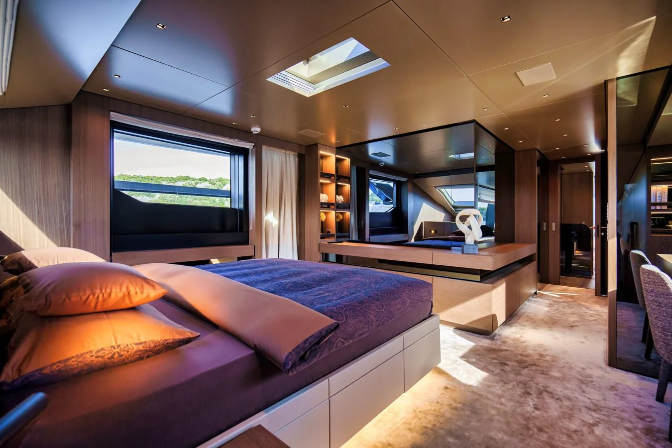 The master stateroom features luxurious bedding, modern design, and ample natural light. aboard DESTINO Yacht for Sale