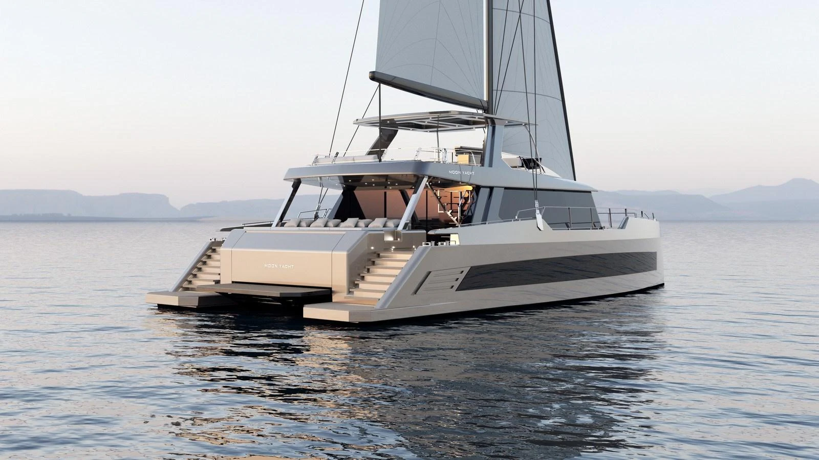 A sleek and modern catamaran yacht glides gracefully on calm waters at sunset. aboard MOON 70 SAIL Yacht for Sale