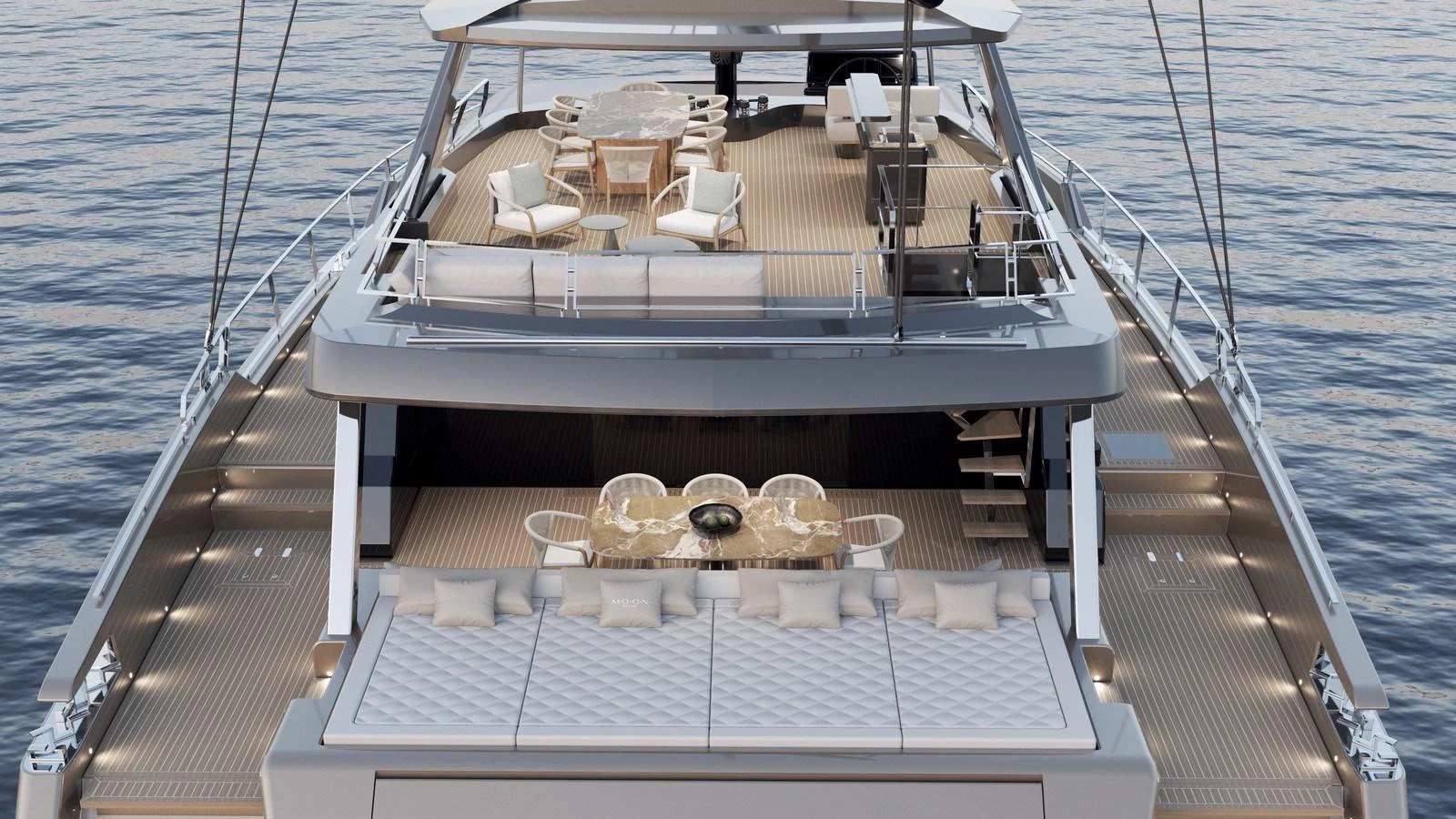 The yacht's aft deck features elegant dining and lounging areas with a stunning view of the water. aboard MOON 70 SAIL Yacht for Sale