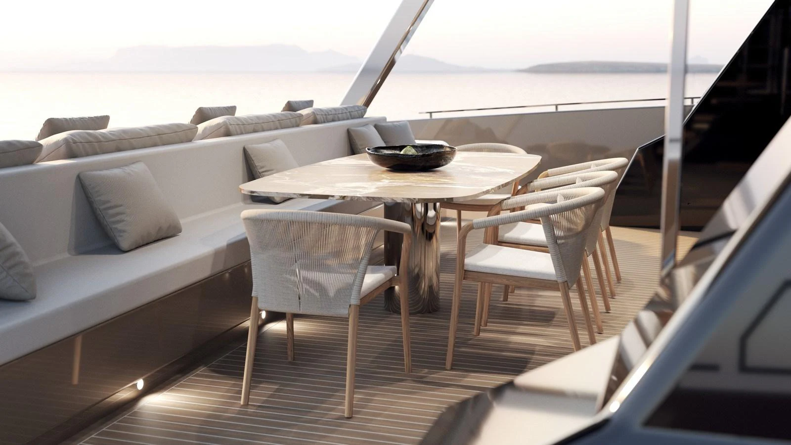 The aft deck features a stylish dining area with a sleek table and comfortable seating, perfect for alfresco meals. aboard MOON 70 SAIL Yacht for Sale