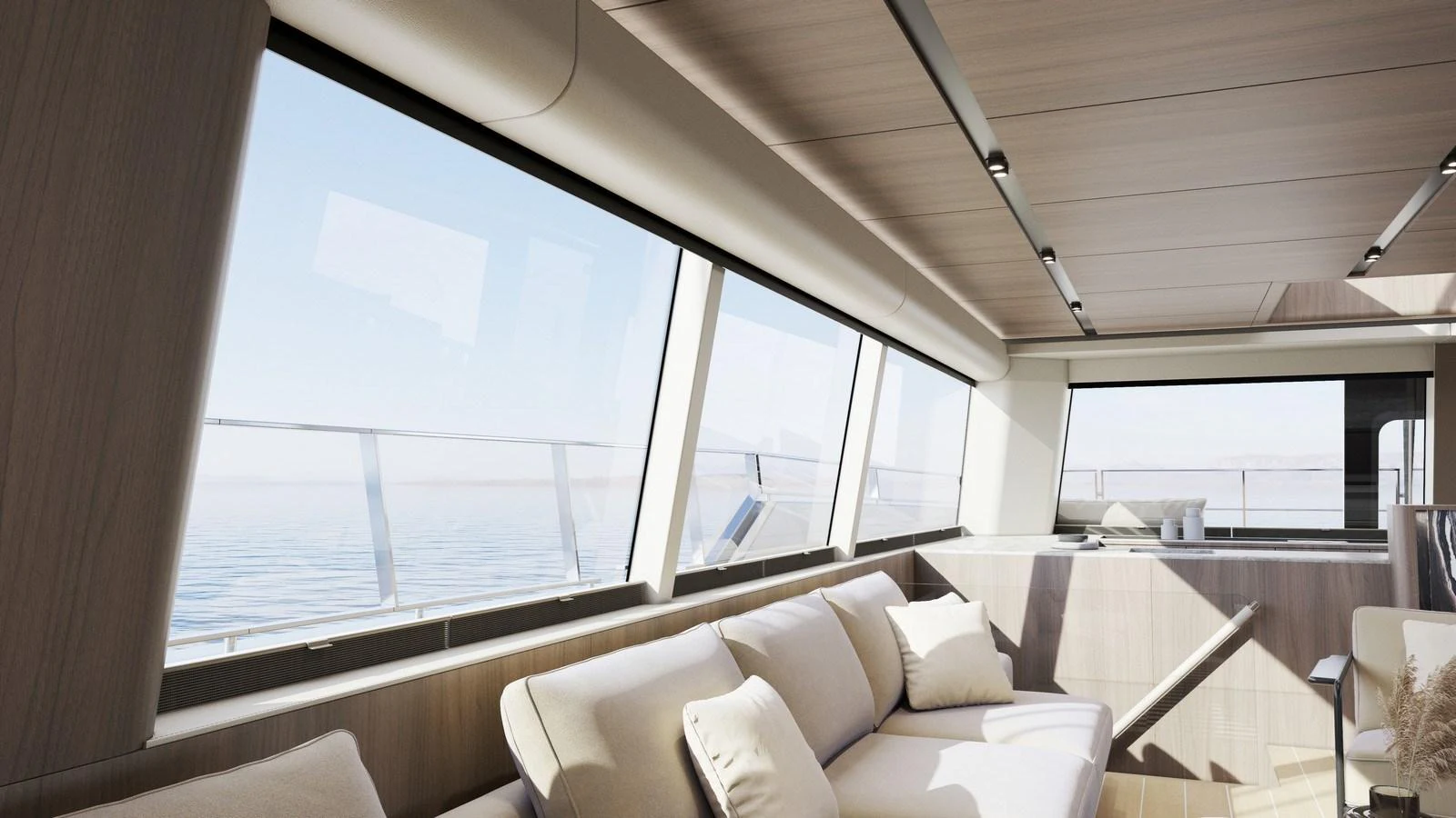 The yacht's interior features a spacious and modern lounge area with large windows offering stunning ocean views. aboard MOON 70 SAIL Yacht for Sale