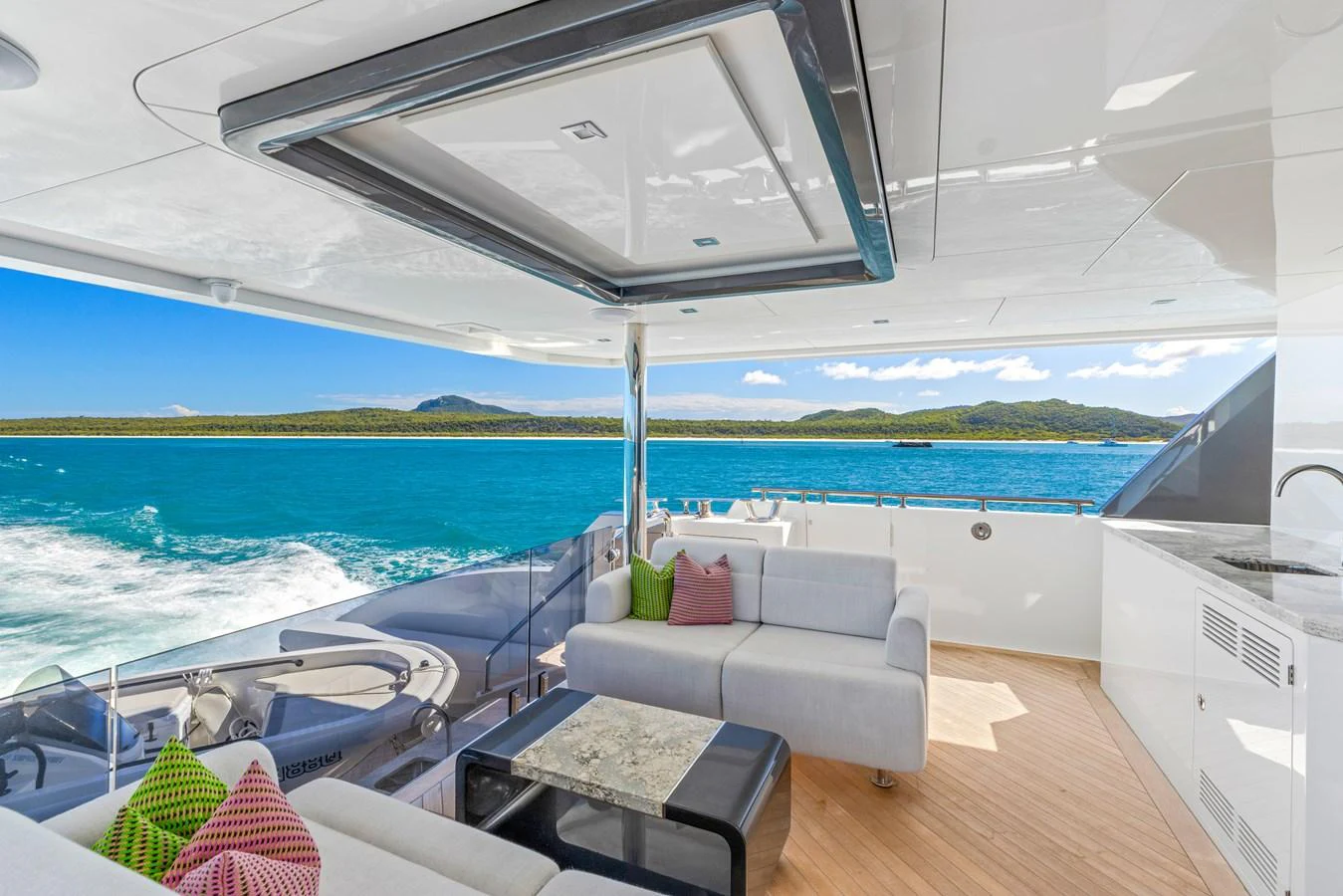 The aft deck features comfortable seating with a stunning ocean view. aboard G Yacht for Sale